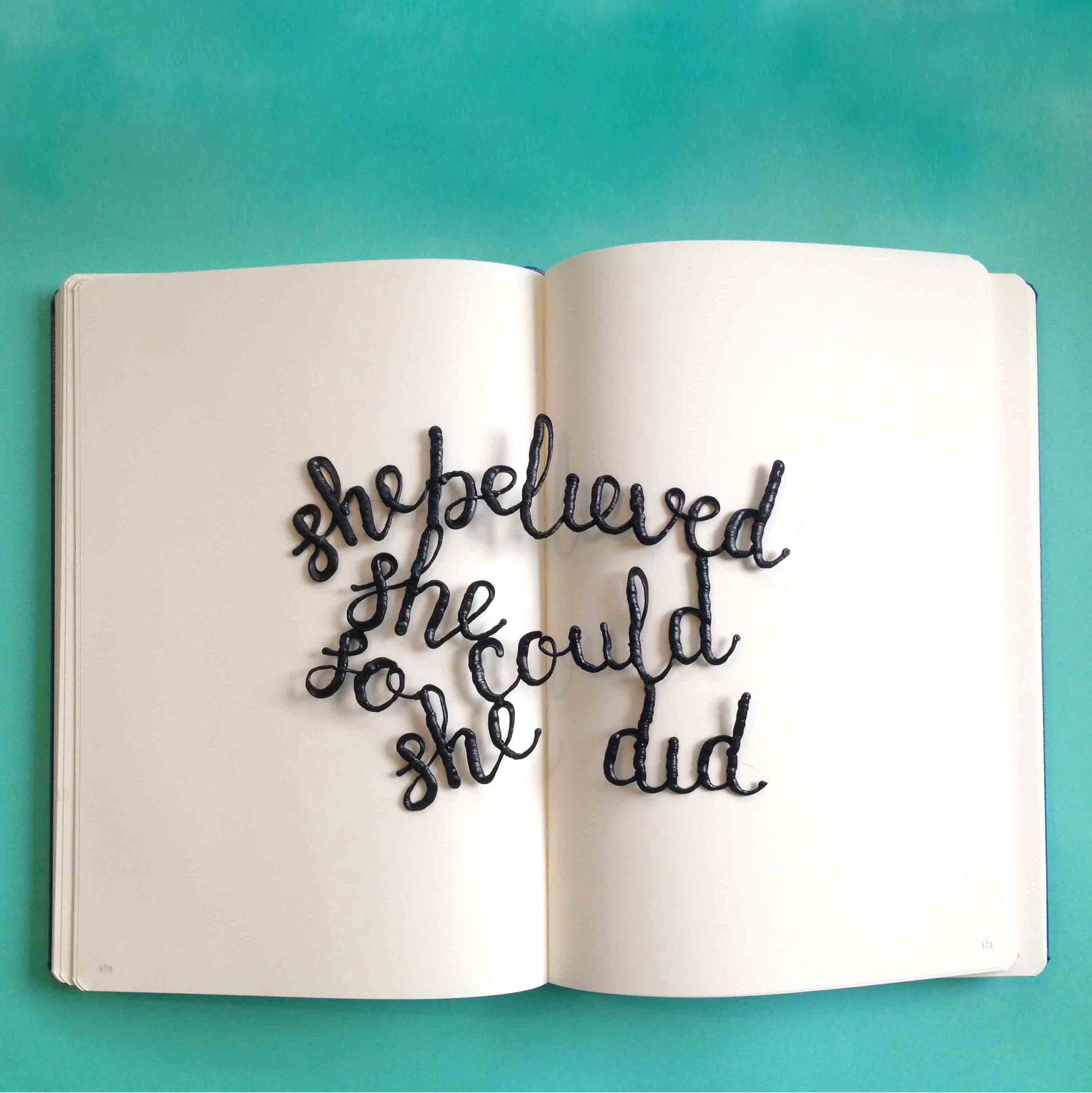 Quote written book on table, 3D pen art.