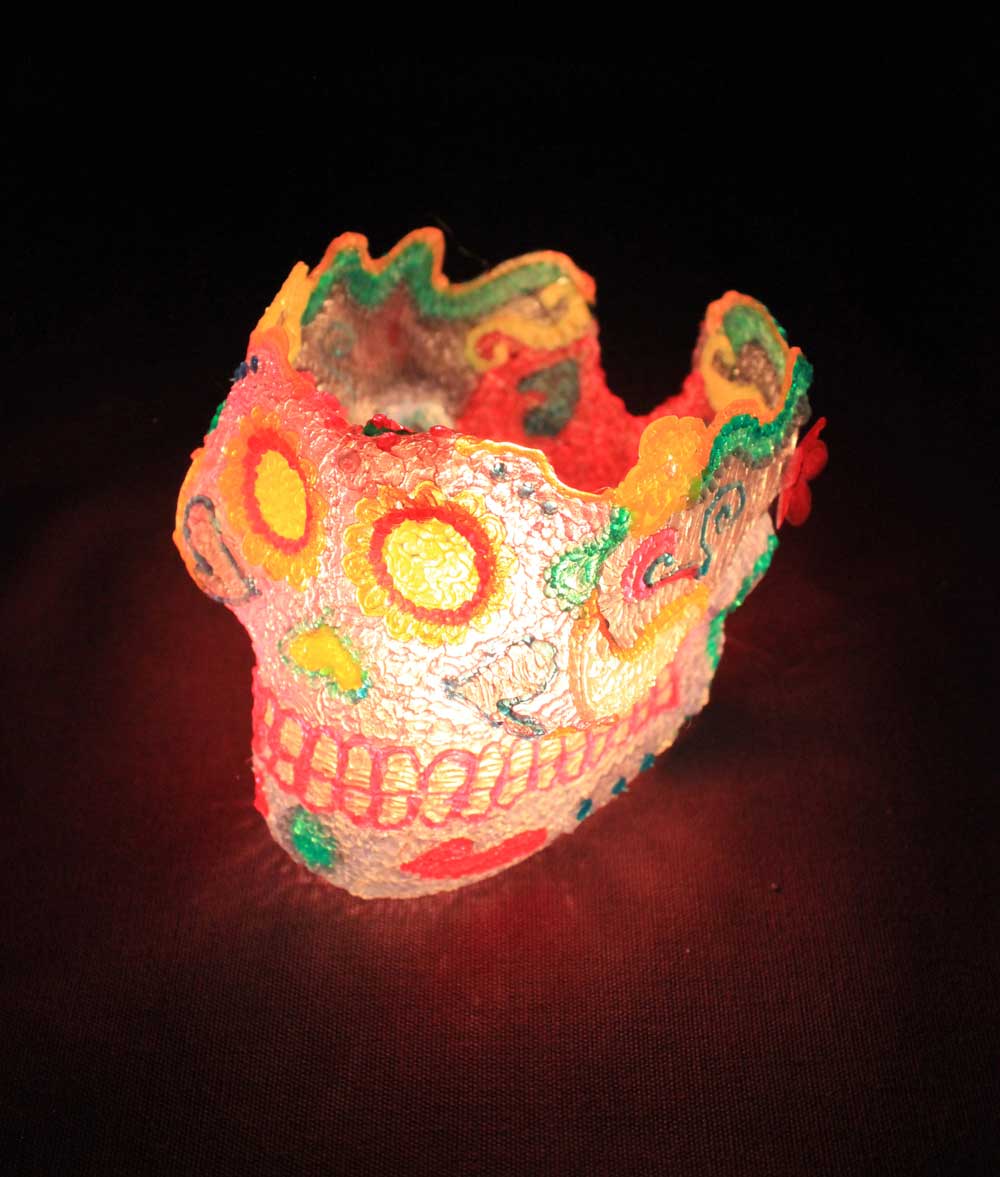 Brightly colored sugar skull with red light - 3D pen art. (59 characters)