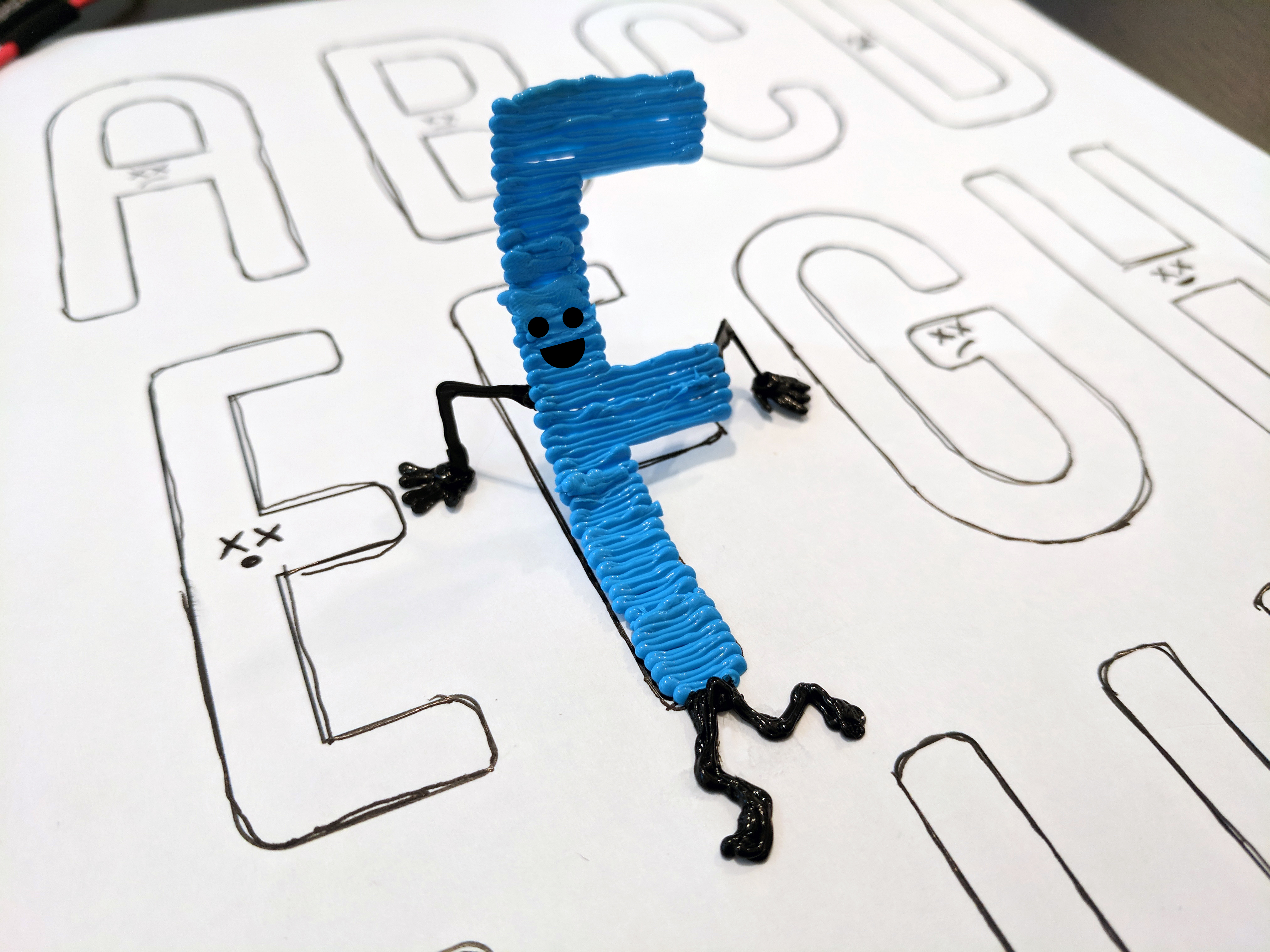 Blue toy on white paper 3D pen art